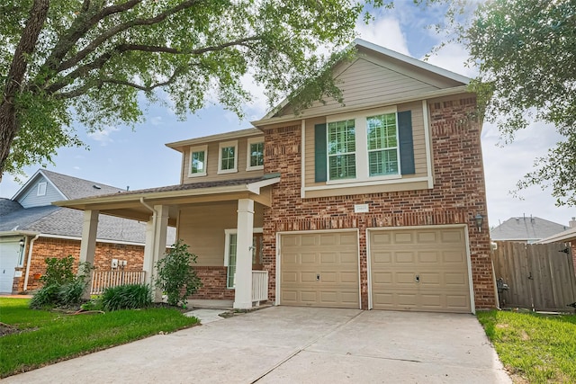 19819 Sternwood Manor Dr, Spring, TX 77379 - view of front facade with brick siding, concrete driveway, an attached garage, and covered porch