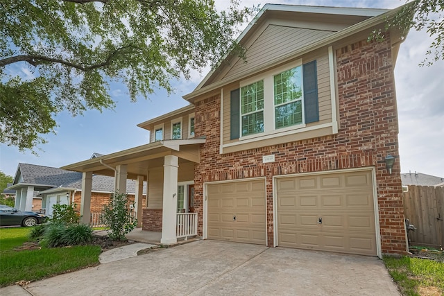19819 Sternwood Manor Dr, Spring, TX 77379 - view of front facade featuring brick siding, an attached garage, concrete driveway, and a porch