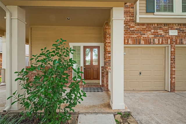 19819 Sternwood Manor Dr, Spring, TX 77379 - property entrance with brick siding, concrete driveway, and covered porch