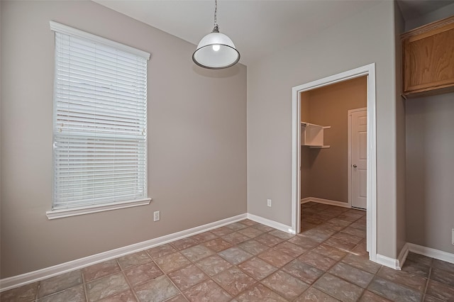 19819 Sternwood Manor Dr, Spring, TX 77379 - unfurnished bedroom featuring stone finish floors, a walk in closet, and a closet