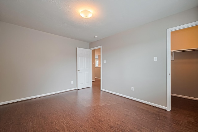 19819 Sternwood Manor Dr, Spring, TX 77379 - unfurnished bedroom featuring wood finished floors, a spacious closet, and a closet