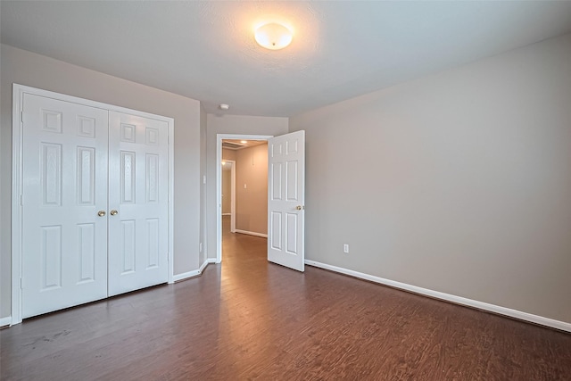 19819 Sternwood Manor Dr, Spring, TX 77379 - unfurnished bedroom featuring dark wood finished floors and a closet