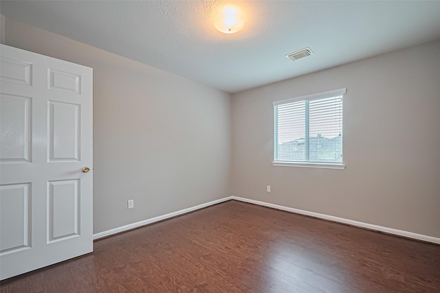 19819 Sternwood Manor Dr, Spring, TX 77379 - empty room with dark wood-type flooring and baseboards