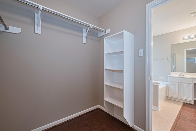 19819 Sternwood Manor Dr, Spring, TX 77379 - walk in closet with a sink and wood finished floors