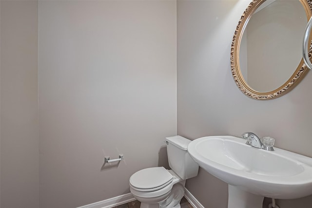 19819 Sternwood Manor Dr, Spring, TX 77379 - half bathroom featuring a sink and toilet
