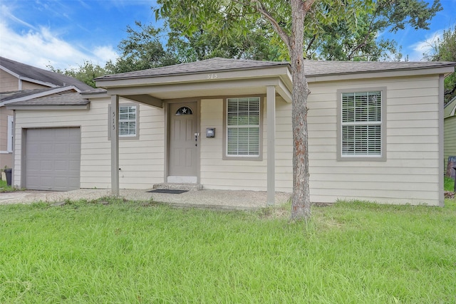 515 Main St, Pasadena, TX 77506 - view of front of property with an attached garage, a shingled roof, a front yard, and concrete driveway