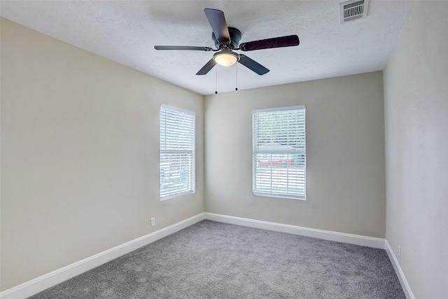 515 Main St, Pasadena, TX 77506 - carpeted empty room with ceiling fan and a textured ceiling