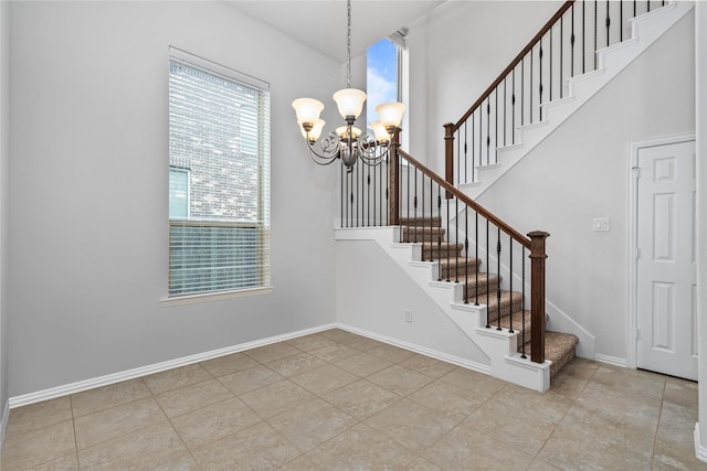 4831 Sunset Park Ln, Rosharon, TX 77583 - stairs featuring a chandelier and tile patterned floors