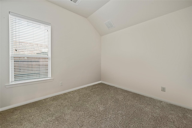 4831 Sunset Park Ln, Rosharon, TX 77583 - carpeted empty room featuring lofted ceiling and baseboards