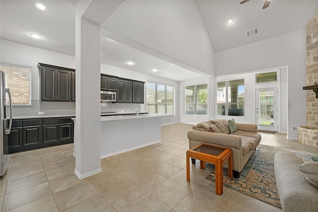 4831 Sunset Park Ln, Rosharon, TX 77583 - living room featuring ceiling fan, light tile patterned floors, recessed lighting, and high vaulted ceiling
