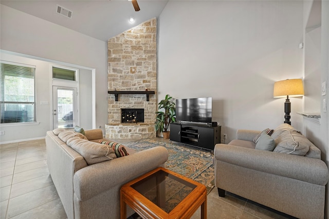 4831 Sunset Park Ln, Rosharon, TX 77583 - tiled living area featuring a ceiling fan, high vaulted ceiling, and a fireplace