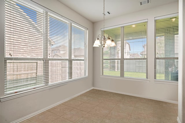 4831 Sunset Park Ln, Rosharon, TX 77583 - unfurnished dining area with plenty of natural light, a chandelier, and tile patterned floors