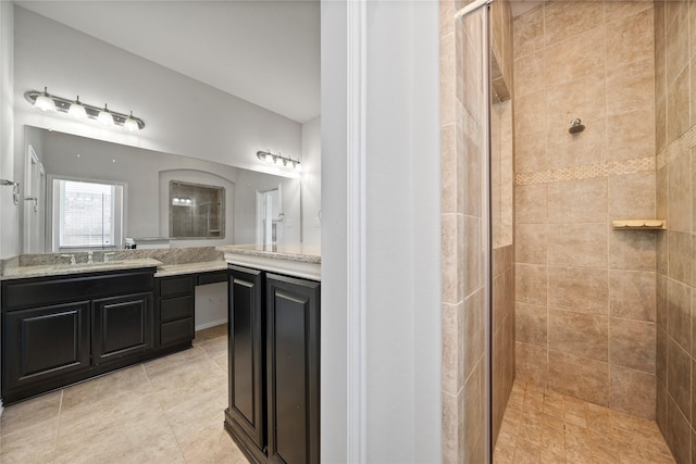 4831 Sunset Park Ln, Rosharon, TX 77583 - bathroom with a tile shower, vanity, and tile patterned flooring