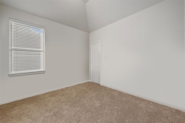 4831 Sunset Park Ln, Rosharon, TX 77583 - carpeted empty room featuring vaulted ceiling and baseboards