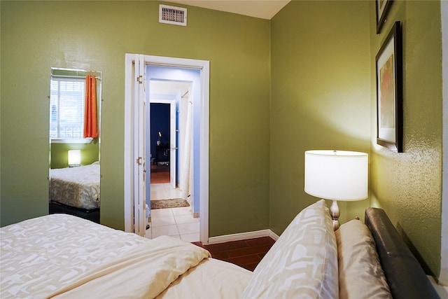 4004 Montrose Blvd Unit 45A, Houston, TX 77006 - bedroom featuring baseboards and ensuite bath
