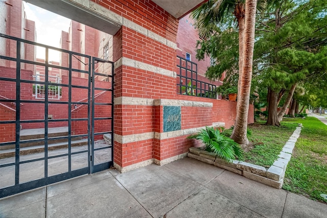 4004 Montrose Blvd Unit 45A, Houston, TX 77006 - view of property exterior with brick siding and a gate