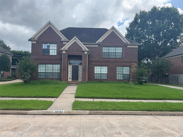 18703 Evergreen Falls Dr, Houston, TX 77084 - traditional home with brick siding and a front lawn