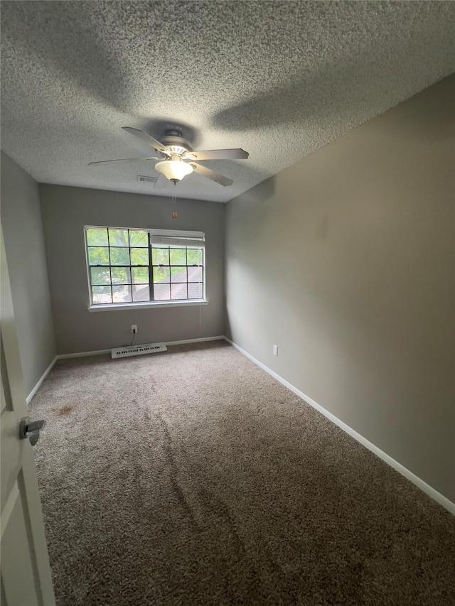 18703 Evergreen Falls Dr, Houston, TX 77084 - unfurnished room featuring a textured ceiling, carpet floors, and a ceiling fan