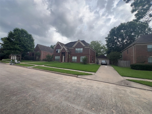 18703 Evergreen Falls Dr, Houston, TX 77084 - traditional-style house with brick siding, a front lawn, a detached garage, and concrete driveway