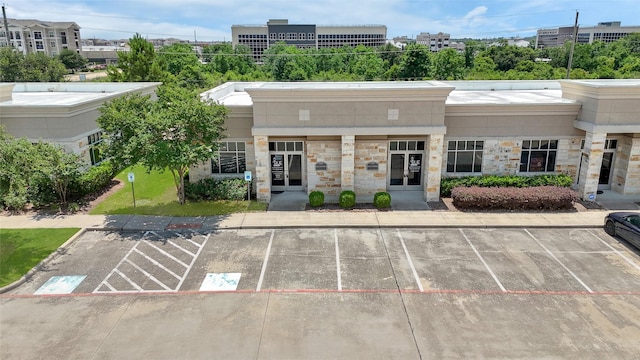 440 Cobia Dr Unit 1804, Katy, TX 77494 - view of building exterior featuring uncovered parking