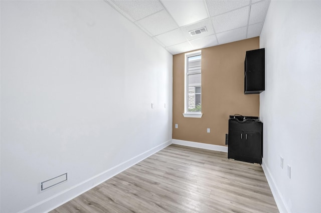 440 Cobia Dr Unit 1804, Katy, TX 77494 - unfurnished living room featuring a paneled ceiling and light wood-type flooring