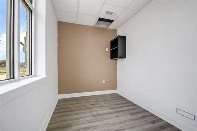 440 Cobia Dr Unit 1804, Katy, TX 77494 - unfurnished room with a paneled ceiling and light wood-style floors