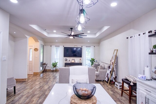 1226 Rd 5007, Cleveland, TX 77327 - living area featuring arched walkways, a raised ceiling, recessed lighting, wood finished floors, and ceiling fan