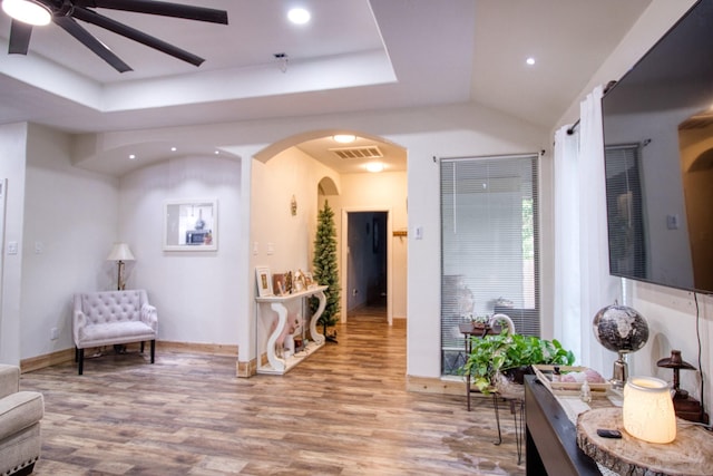 1226 Rd 5007, Cleveland, TX 77327 - sitting room with wood finished floors, arched walkways, a ceiling fan, recessed lighting, and a tray ceiling
