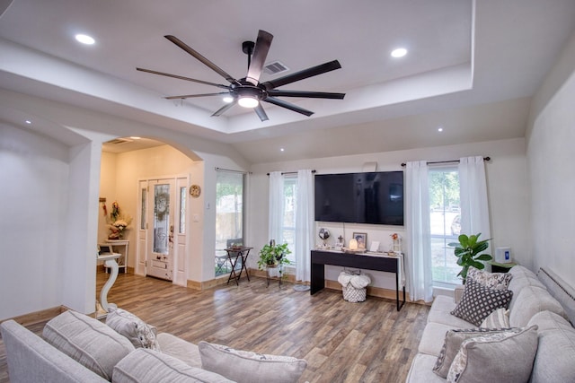 1226 Rd 5007, Cleveland, TX 77327 - living room with arched walkways, a raised ceiling, wood finished floors, ceiling fan, and recessed lighting