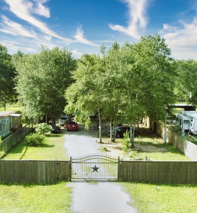 1226 Rd 5007, Cleveland, TX 77327 - view of home's community featuring a gate