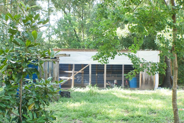 1226 Rd 5007, Cleveland, TX 77327 - back of property with exterior structure and an outbuilding