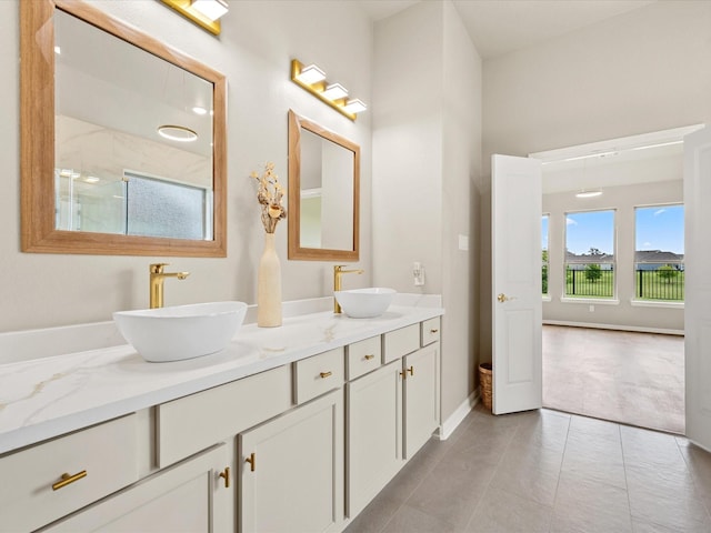15754 Cairnwell Bend Dr, Humble, TX 77346 - bathroom with double vanity, a shower, and tile patterned flooring
