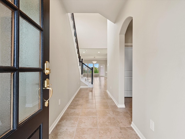 15754 Cairnwell Bend Dr, Humble, TX 77346 - foyer entrance with light tile patterned flooring, stairs, arched walkways, and recessed lighting
