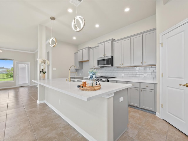 15754 Cairnwell Bend Dr, Humble, TX 77346 - kitchen featuring stainless steel appliances, gray cabinetry, tasteful backsplash, light countertops, and recessed lighting