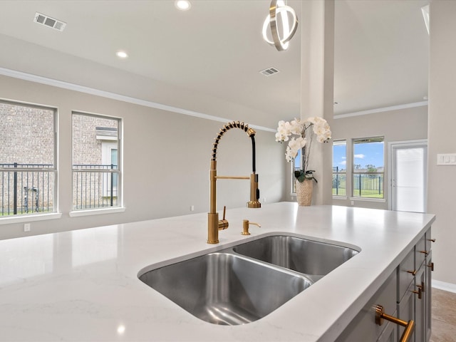 15754 Cairnwell Bend Dr, Humble, TX 77346 - kitchen view of crown molding, light stone counters, recessed lighting, and pendant lighting
