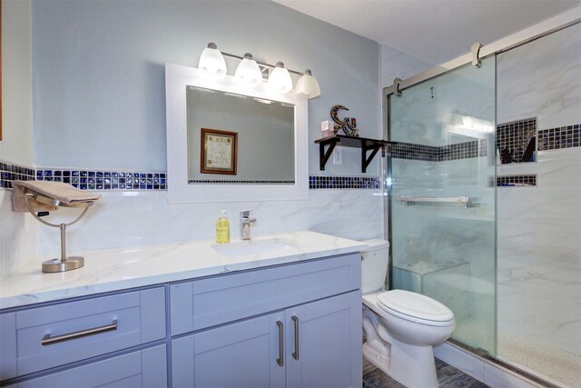 840 Threadneedle St E Unit 208, Houston, TX 77079 - full bath featuring tile walls, a stall shower, and vanity
