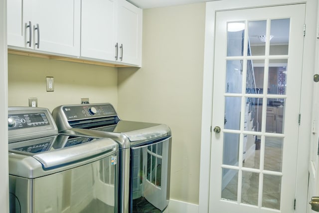 840 Threadneedle St E Unit 208, Houston, TX 77079 - laundry room with cabinet space and washing machine and clothes dryer
