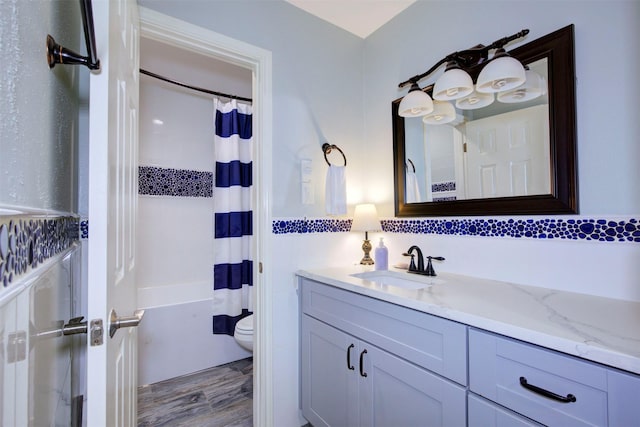 840 Threadneedle St E Unit 208, Houston, TX 77079 - full bathroom with vanity, wood finished floors, and shower / bath combo with shower curtain