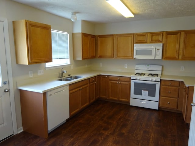 21606 Haylee Way, Humble, TX 77338 - kitchen with white appliances, dark wood-type flooring, light countertops, brown cabinets, and a textured ceiling