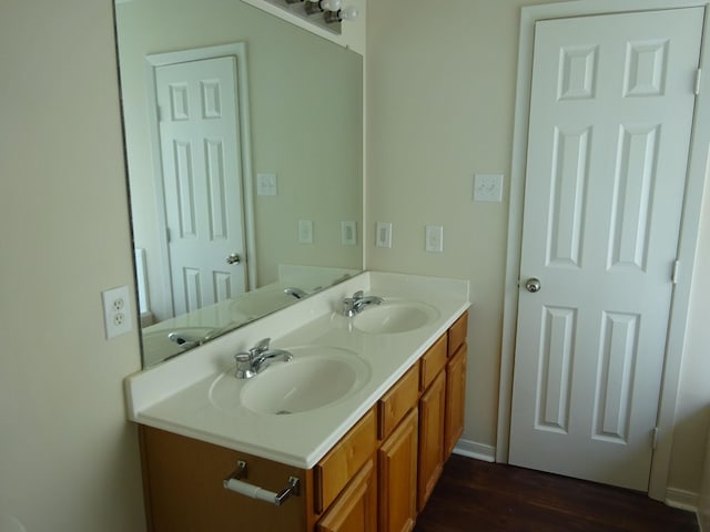 21606 Haylee Way, Humble, TX 77338 - bathroom featuring wood finished floors and double vanity