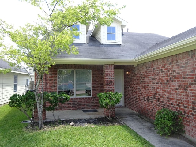 21606 Haylee Way, Humble, TX 77338 - property entrance with brick siding and a lawn