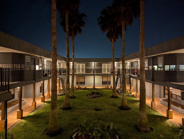 709 Gale St Unit 14, Seabrook, TX 77586 - yard at twilight featuring a yard and stairs