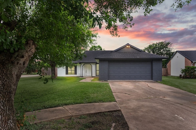 16234 Bowridge Ln, Houston, TX 77053 - view of front facade featuring roof with shingles, a front lawn, driveway, and brick siding
