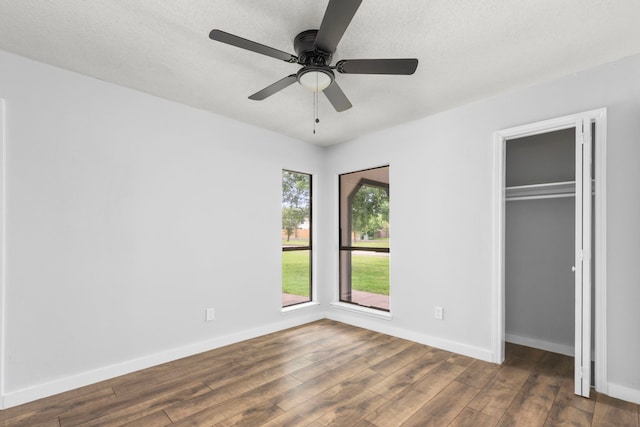 16234 Bowridge Ln, Houston, TX 77053 - unfurnished bedroom with wood finished floors, a closet, and ceiling fan