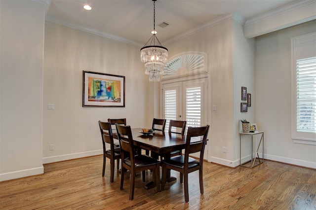 4314 Gibson St Unit B, Houston, TX 77007 - dining area featuring light wood-style floors, healthy amount of natural light, a chandelier, ornamental molding, and recessed lighting