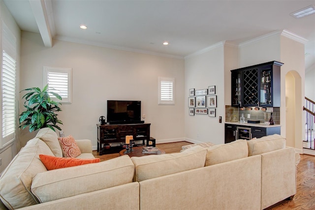 4314 Gibson St Unit B, Houston, TX 77007 - living area featuring bar, arched walkways, wood finished floors, recessed lighting, and crown molding