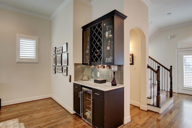 4314 Gibson St Unit B, Houston, TX 77007 - indoor dry bar with beverage cooler, light wood finished floors, tasteful backsplash, arched walkways, and ornamental molding