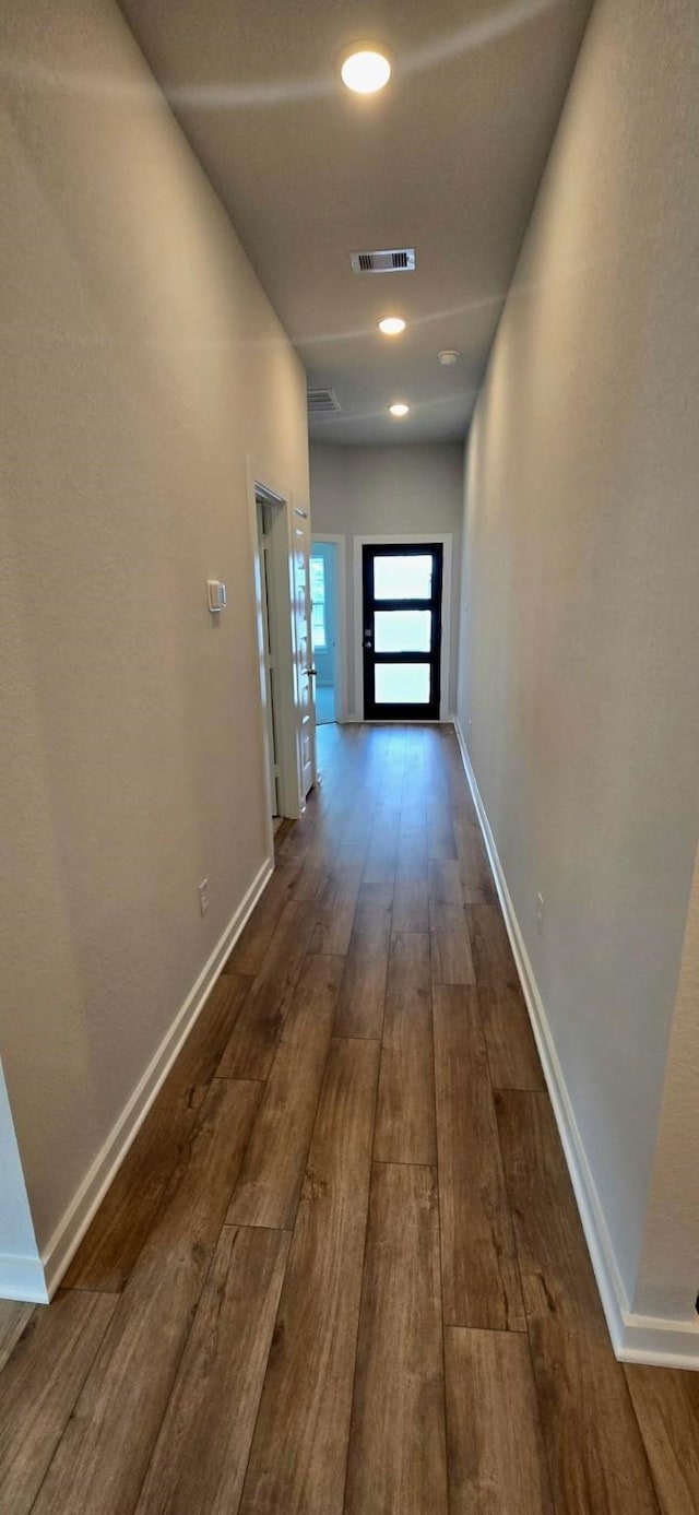 2556 Newport Breeze Dr, Katy, TX 77493 - corridor featuring dark wood-type flooring and baseboards