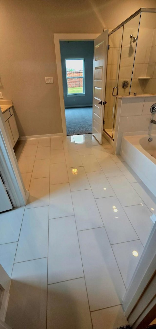 2556 Newport Breeze Dr, Katy, TX 77493 - bathroom with a stall shower, tile patterned flooring, and a tub to relax in
