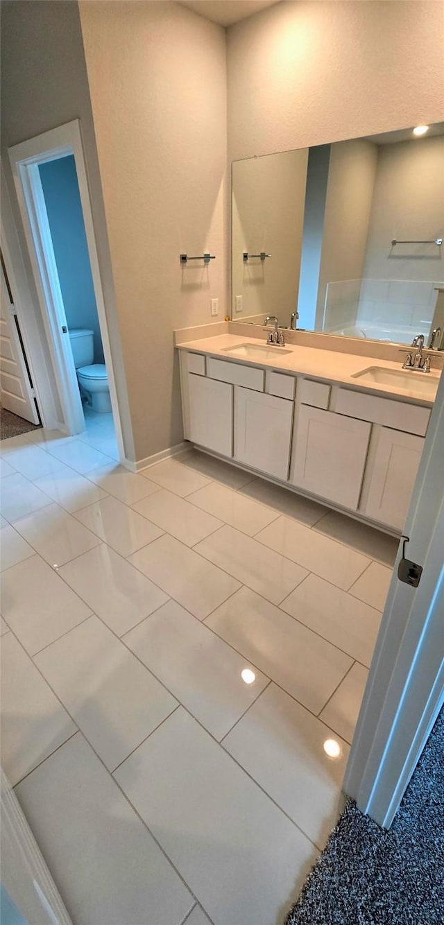 2556 Newport Breeze Dr, Katy, TX 77493 - bathroom with double vanity and tile patterned flooring
